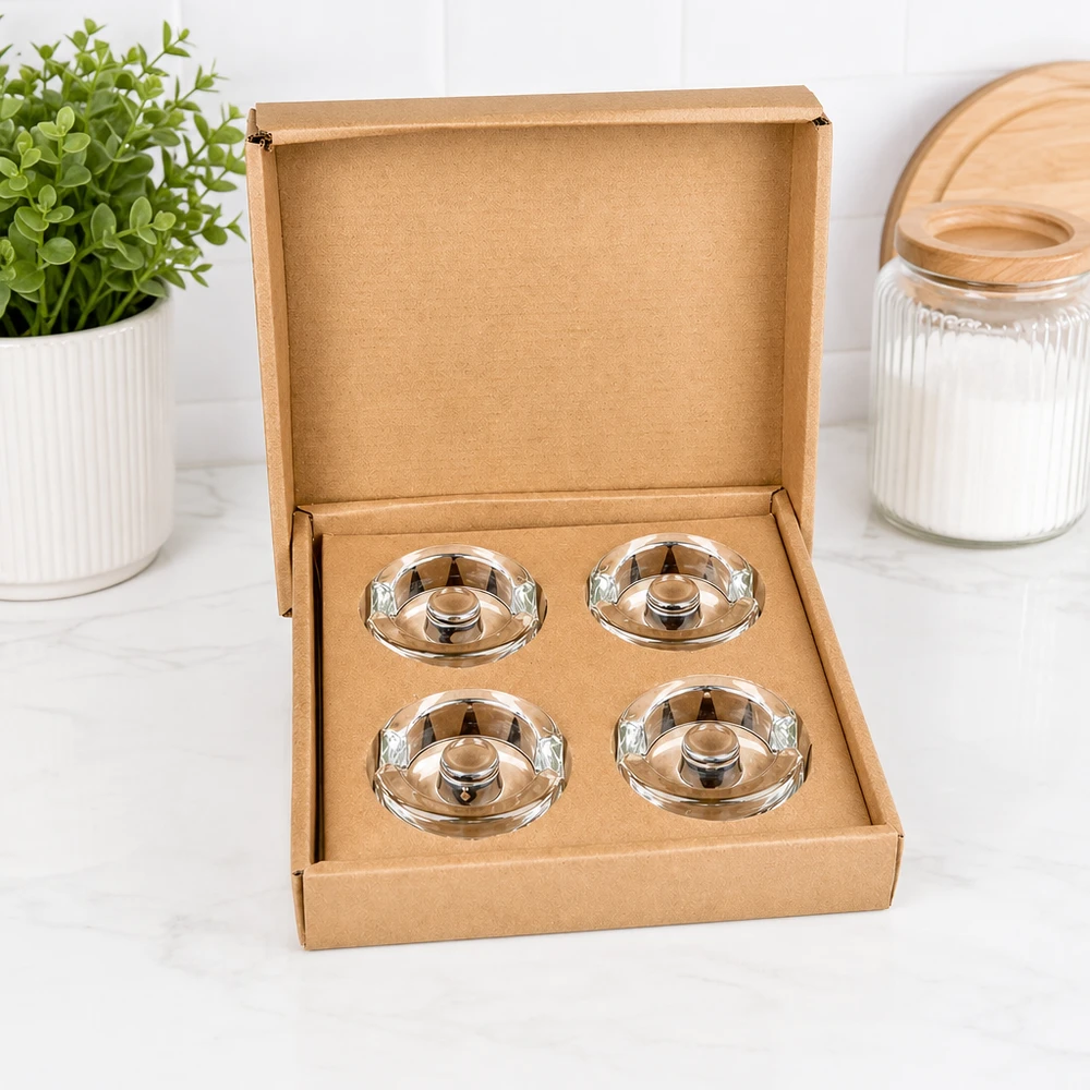 UNiTWIST Fermentier-Glasgewichte 4er Set geöffnet in brauner Schachtel neben Pflanze und Vorratsglas