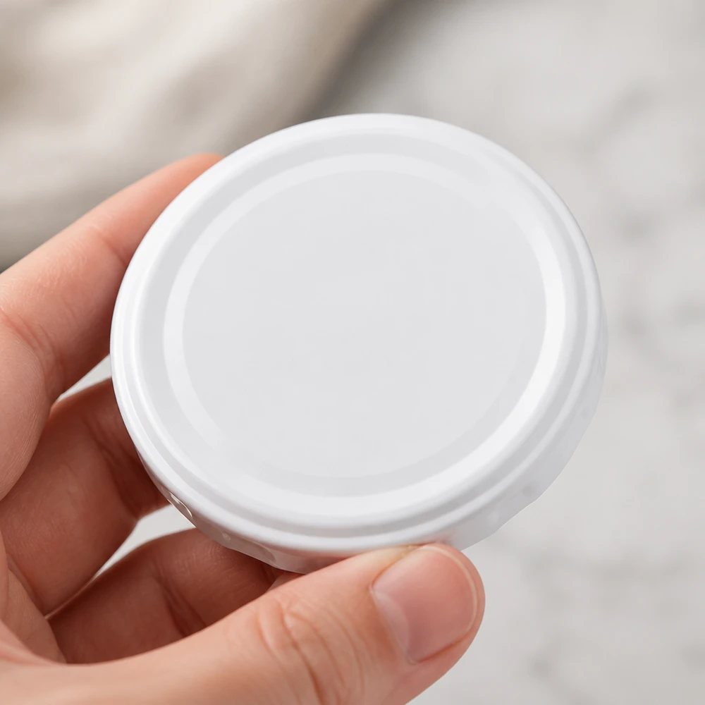 58mm BasicSeal Deckel weiss (TO58deep) UNiTWIST 58mm BasicSeal TO58deep Twist-Off Deckel weiss aus Weißblech für gewerbliche Abfüllung in großen Mengen